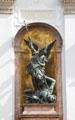 St Michael slaying dragon sculpture at St Michael Kirche. Munich, Germany.