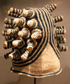 Woven knobbed hat from Bamenda culture of Cameroon at Five Continents Museum. Munich, Germany.
