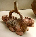 Moche culture ceramic stirrup vessel in shape of crocodile from north coast of Peru at Five Continents Museum. Munich, Germany.
