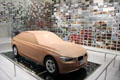 Aerodynamic prototype model in mirrored photomosaic room at BMW Museum. Munich, Germany.