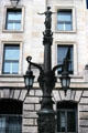 Lamp stand topped with female figure beside Bundestag. Berlin, Germany.