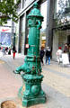 Antique cast iron water pump by Schoening of Berlin on Kurfurstendam. Berlin, Germany.