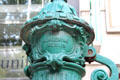 Detail of antique cast iron water pump by Schoening of Berlin on Kurfurstendam. Berlin, Germany.