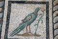 Detail of collared bird pecking at flower on Roman mosaic section of Orpheus floor from Miletus at Pergamon Museum. Berlin, Germany.