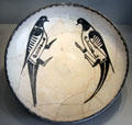 Earthenware dish painted with two birds from Iran at Pergamon Museum. Berlin, Germany.