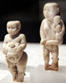 Egyptian predynastic ivory figures of women with child at Neues Museum. Berlin, Germany.