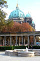 Courtyard in front of Alte Nationalgalerie with Berlin Cathedral beyond arcade. Berlin, Germany.
