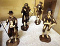 Group of carved wood & ivory figurines of beggars from southern Germany at German Historical Museum. Berlin, Germany.