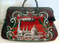 Travel bag embroidered with steam locomotive from Germany at German Historical Museum. Berlin, Germany