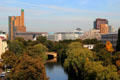 Canal with modern redevelopment around Potsdamer Platz in distance. Berlin, Germany.