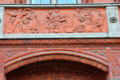 Food market frieze by Otto Geyer on balcony of Rotes Rathaus. Berlin, Germany.