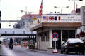 Checkpoint Charlie with empty East German inspection lines beyond. Berlin, Germany.