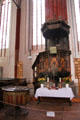 Inlaid pulpit & baptismal font at St. Mary's Church. Greifswald, Germany.