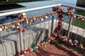 Love locks stacked on fencing at Hohenzollern Bridge. Köln, Germany.