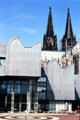 Ludwig Museum with spires of Köln Cathedral in background. Köln, Germany.