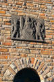 Crest with woman & two children on brick wall. Cochem, Germany.