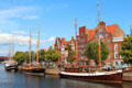 Sailing ships docked along Trave River. Lübeck, Germany.