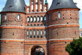 Archway leading through towers & over bridge into Lübeck via Holsten Gate. Lübeck, Germany.