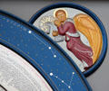 Angel symbol of Evangelist St. Matthew on saints day calendar clock at St. Mary's Church. Lübeck, Germany.