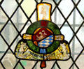 Stained glass window with family arms at Gottorf Palace. Schleswig, Germany.