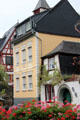 Building with front garden in bloom. Bacharach, Germany.