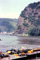 Working barge on Rhine River traveling past The Loreley. Loreley, Germany.