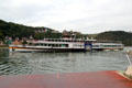 Sightseeing boat passing in front of car ferry. St. Goar, Germany.