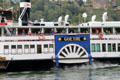 Goethe sightseeing boat passing in front of St. Goar with passengers enjoying the view. St. Goar, Germany.