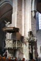 Pulpit & steps at Trier Cathedral under Romanesque arches. Trier, Germany.