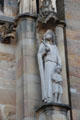 Religious statue on Liebfrauenkirche facade. Trier, Germany.