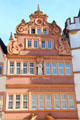 Baroque style building with religious statue in niche on Hauptmarkt. Trier, Germany.