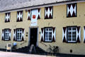 Zons museum with banner for Poppy Art exhibit. Zons, Germany.