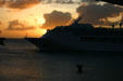 Norwegian Sky departing at sunset. Dominica.