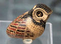 Greek terracotta oil flask in shape of owl from Corinth at Antikensammlungen. Munich, Germany
