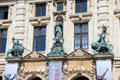 Sculptures atop portal of Bavarian National Museum. Munich, Germany.