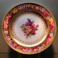Sèvres porcelain plate painted with flowers a gift from Napoleon to King of Bavaria at Bavarian National Museum. Munich, Germany.
