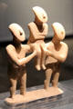 Cycladic marble group carving of two males holding female at Bavarian State Archaeological Collection. Munich, Germany.