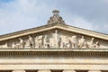Pediment with Athena protecting sculptural arts by Johann Martin von Wagner over entrance of Glyptothek. Munich, Germany.