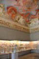 Lustheim Palace rococo ceiling fresco by Giovanni Trubillio shows giants storming the heaven of gods over gallery of Meissen porcelain. Munich, Germany.