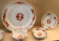Meissen porcelain serving dishes with red dragon pattern at Meissen porcelain museum at Lustheim Palace. Munich, Germany.