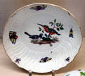 Meissen porcelain bowl painted with birds & insects at Meissen porcelain museum at Lustheim Palace. Munich, Germany.