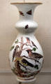 Meissen porcelain white vase painted with birds & insects at Meissen porcelain museum at Lustheim Palace. Munich, Germany.