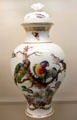 Meissen porcelain covered white vase painted with birds & insects at Meissen porcelain museum at Lustheim Palace. Munich, Germany.