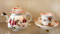 Meissen porcelain teapot & cup in "Rose Family" decor at Meissen porcelain museum at Lustheim Palace. Munich, Germany.