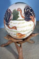 Painted ostrich egg on tripod stand at folk art Collection Gertrud Weinhold. Munich, Germany