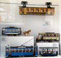 Models of Munich horse tram , electric tram & omnibus under Wuppertal suspension railway car at Deutsches Museum Transport Museum. Munich, Germany.
