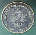Metal plaque for Daimler belt driven motor wagon by Wilhelm Maybach of Cannstatt at Deutsches Museum Transport Museum. Munich, Germany.