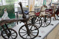 Child's velocipede & tricycle with horse as seat from France at Deutsches Museum Transport Museum. Munich, Germany.