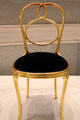 Golden bentwood chair by Michael Thonet of Vienna at Pinakothek der Moderne. Munich, Germany.