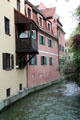 Canal running beside houses near Brechthaus Museum. Augsburg, Germany.